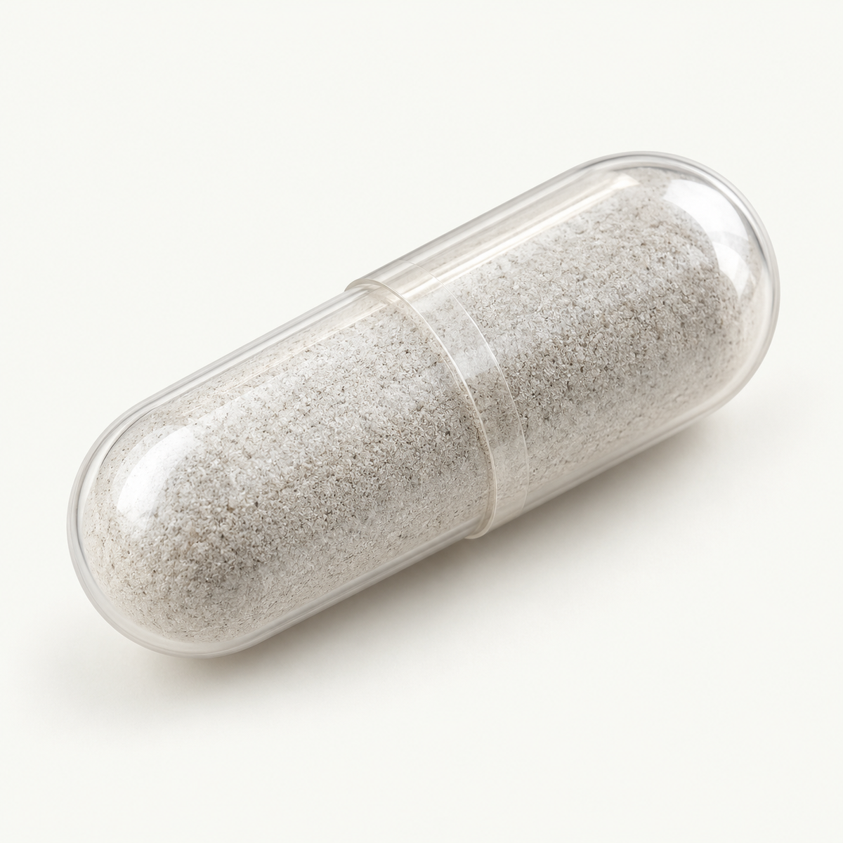 Illustration of a clear capsule with light gray powder filling